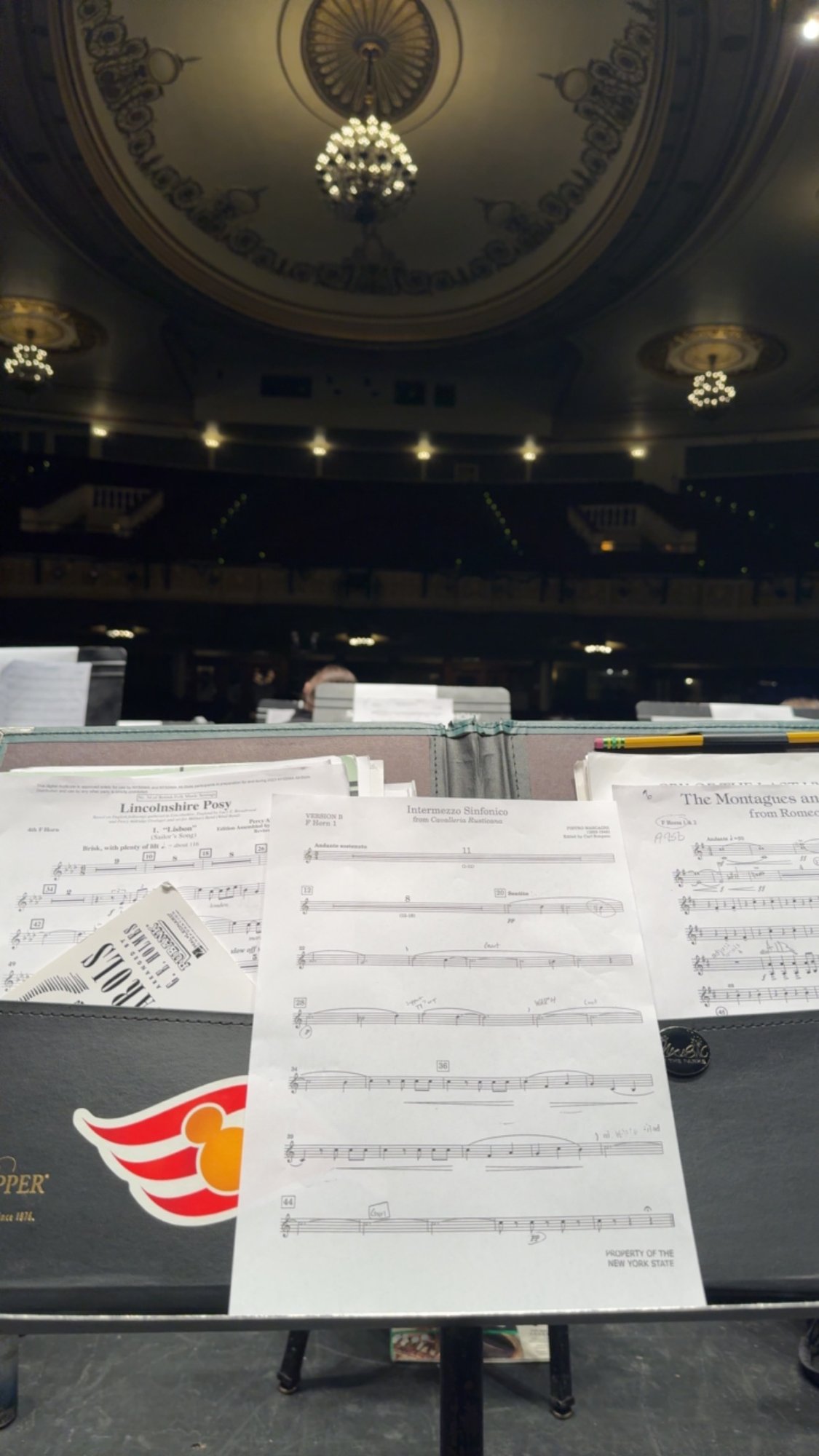 Nick's music folder with Intermezzo Sinfonico displayed on his stand on stage at Proctors Theatre