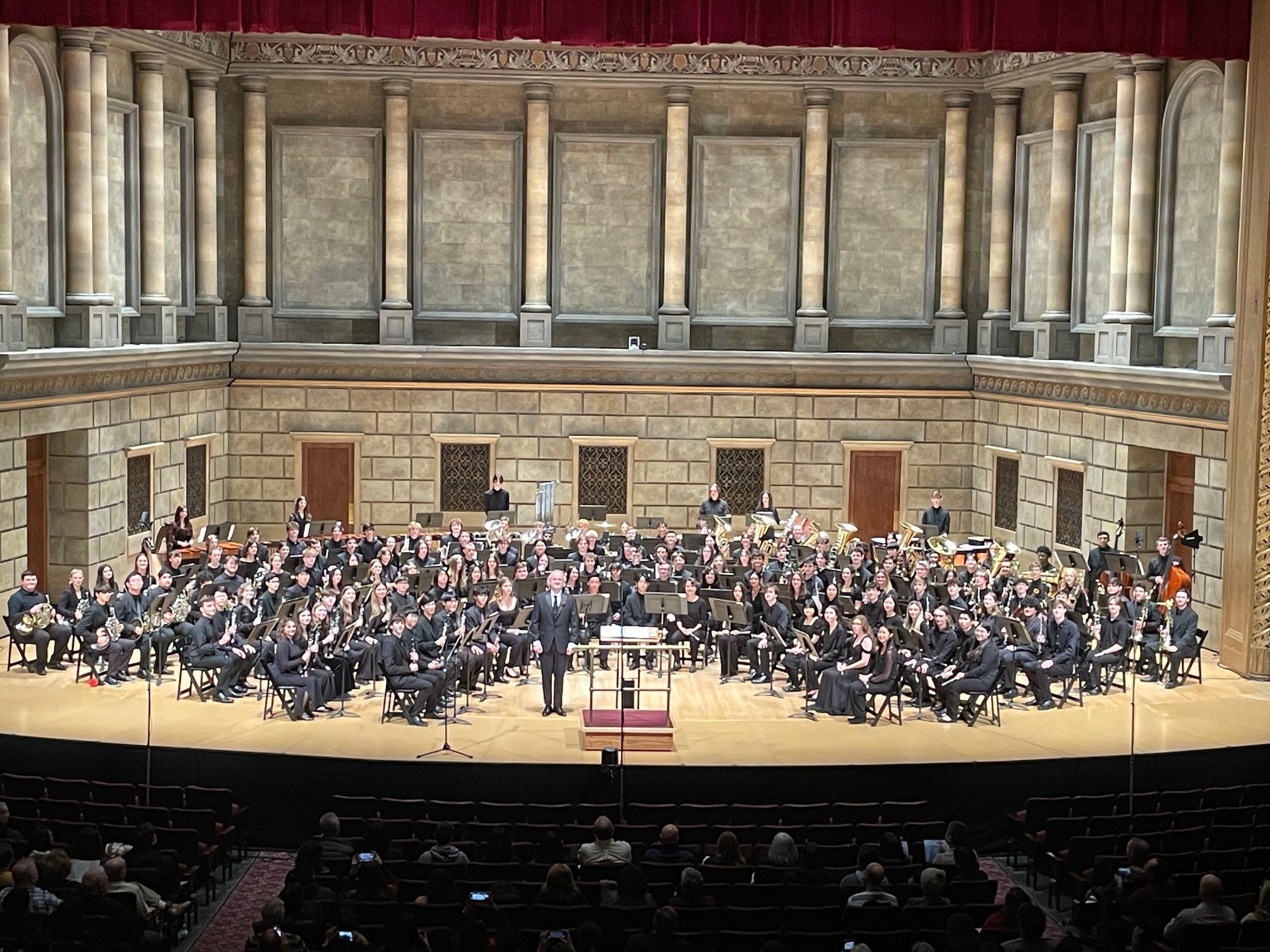 A group picture of the NYSSMA All State Symphonic Band 2023 with Mr. Jeff Grogan conducting